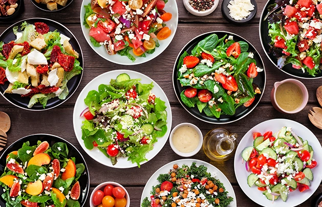 table filled with different salads
