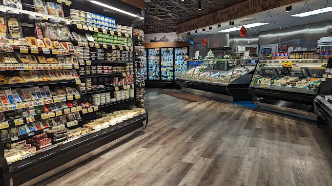 cheese aisle and seafood counter found at Nicholas Markets The Fresh Grocer of Colonia grocery store